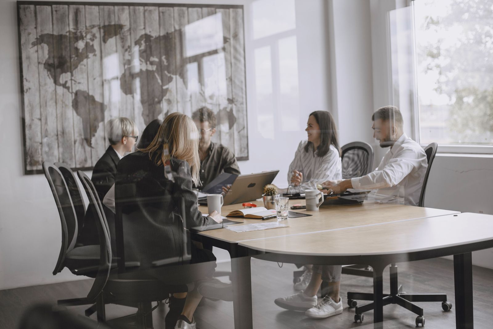 A management team working together around a meeting table